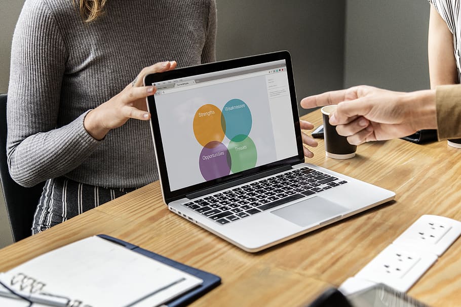 Woman Showing Chart Displayed on Laptop, adults, brainstorming, HD wallpaper